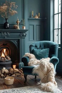 a dog sitting in a chair next to a fire place