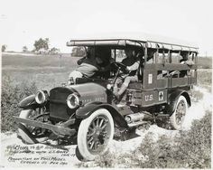 an old black and white photo of two men in a truck