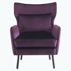 a purple chair sitting on top of a white floor