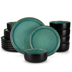 a set of green and black dinnerware