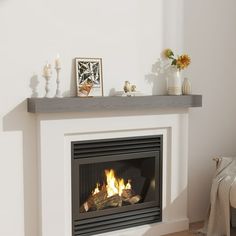 a fire place in a living room with white walls