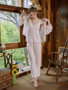 Design Highlights The design of a classic camisole pajama set combined with a vintage palace style looks very elegant and high-end, and the mesh robe makes it even more romantic. Exquisite embroidery, cute bows and see-through mesh, these detailed design embellishments make the overall pajamas more feminine and noble. The fabric uses a double-layer design, and the inner layer is modal made of viscose and spandex, which is very skin-friendly, breathable and extremely comfortable to wear. The ... Mesh Robe, Romantic Autumn, Pajamas Aesthetic, Embroidery Cute, Embroidered Robes, Mesh Embroidery, Vintage Nightgown, Lace Cutout, Lace Dress With Sleeves