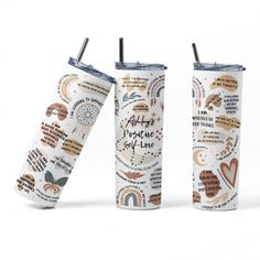 two insulated tumbles with different words on them