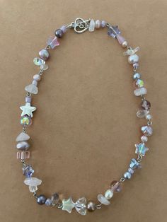 Handmade beaded crystal choker with purple and pink accents. Includes saltwater pearls as well as rose quartz ! Purple Beaded Necklace, Purple Bead Necklace, Flagstaff Az, Diy Collier, Purple Collar, Indie Jewelry, Bracelets Design, Saltwater Pearls, Fairy Necklace