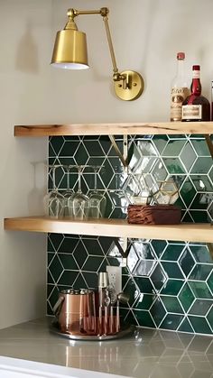 the shelves in the kitchen are filled with bottles and glasses, including one that is gold