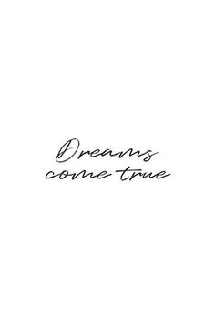 the words dreams come true written in black ink