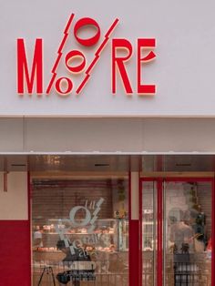 a store front with the word m o r e painted on it