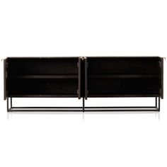 the sideboard has two open shelves on each side and is black with brass handles