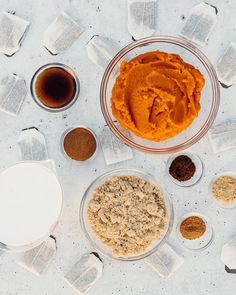 the ingredients to make pumpkin pie laid out on top of each other in separate bowls