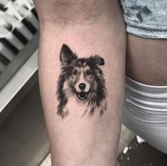 a dog's head is shown on the thigh, and it appears to be black and white