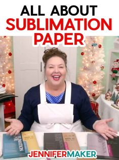 a woman with an apron on sitting in front of some books