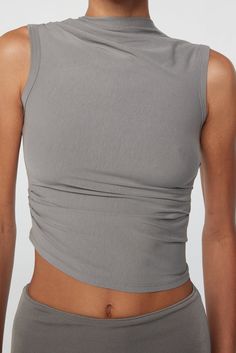 Summer Tops With Ruched Sides And Elastane, Fitted Tank Top For Everyday, Fitted Knit Tank Top For Everyday, Chic Stretch Tank Top With Ruched Back, Sleeveless Summer Tops With Ruched Back, Spring Fitted Seamless Tank Top, Fitted Sleeveless Tank Top With Ruched Back, Spring Stretch Tank Top With Ruched Sides, Sleeveless Elastane Top With Ruched Back