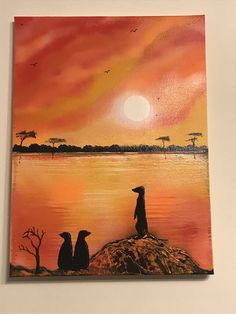 a painting of two dogs sitting on the edge of a body of water at sunset