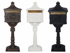 three different types of mail boxes on pedestals