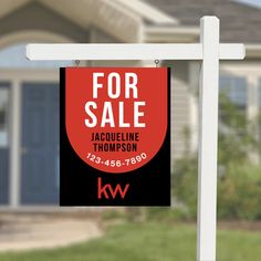 a for sale sign in front of a house