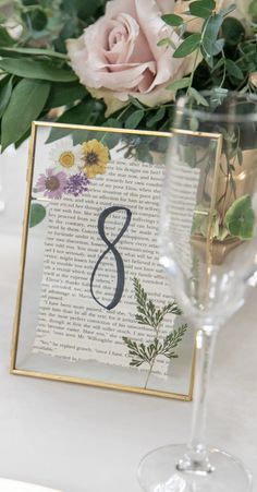 Wedding table numbers in a gold floating clasp frame with a Jane Austen book page & dried flowers pressed inside. Pressed Flower Table Numbers, Pressed Flower Table, Bookish Wedding, Flower Table Numbers, Flower Table, בר מצווה, Future Wedding Plans, Garden Party Wedding, Wildflower Wedding