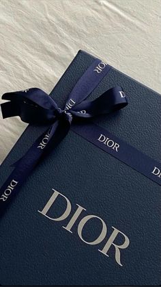 a book with a blue ribbon tied around it