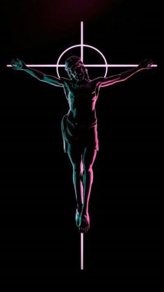 the crucifix is lit up in pink and green