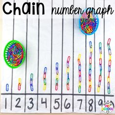 the number graph has been made with colored paper clips and plastic rings to help students learn numbers