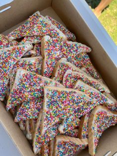 a box filled with lots of sprinkles on top of it's sides