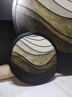 two circular mirrors sitting on top of a table