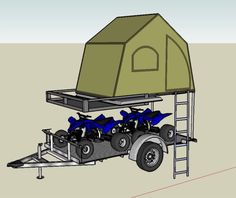 an image of a trailer with some atv's attached to the side and a tent on top