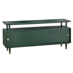 a green tv stand with two doors on one side and an open drawer on the other