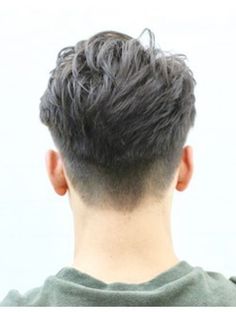 the back of a man's head, with grey hair in front of him