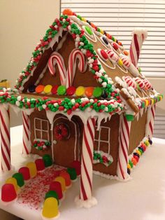 a gingerbread house decorated with candy and candies