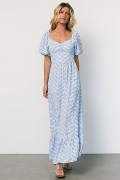 Make an appearance at Sunday brunch or garden parties with the Durban Maxi dress, crafted from flowy crepe chiffon with a charming dusty blue geometric pattern on an off-white backdrop. Featuring a wide sweetheart neckline, smocked back bodice, and lined balloon sleeves, it's both elegant and comfortable. Blue And White Outfits, Dress Dusty Blue, Powder Blue Dress, Blue Geometric Pattern, Max Dress, Baltic Born, Engagement Dresses, Dress Dusty, Garden Parties