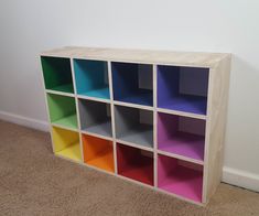 multicolored cubby storage unit against a white wall in a room with carpet