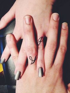 two people with matching rings on their fingers