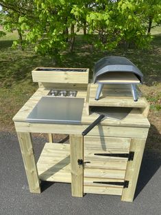 an outdoor grill made out of wood and steel