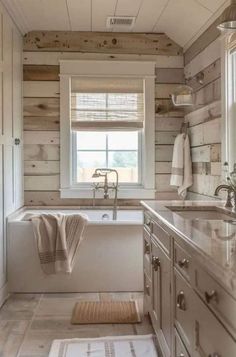 a white bathroom with wooden walls and flooring, along with a large bathtub