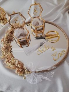 the table is decorated with gold and white decorations