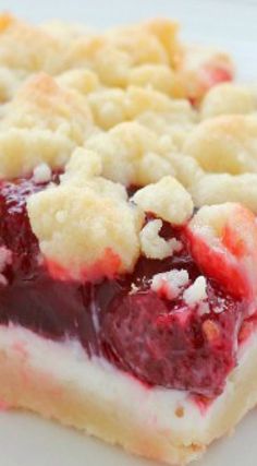 a close up of a piece of food on a white plate with crumbs