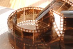 an old film strip sitting on top of a table