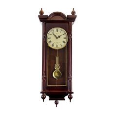 an antique clock with pendulums on the sides and roman numerals at the top