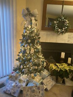 a decorated christmas tree with presents under it