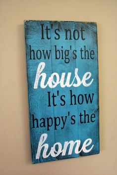 a wooden sign that reads it's not how big the house it's how happy's the home