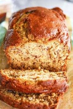 sliced loaf of banana bread sitting on top of a cutting board