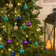 a christmas tree with ornaments hanging from it