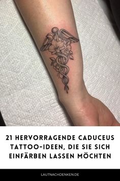 a person with a tattoo on their arm and the words in german are below it