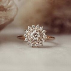 a diamond ring sitting on top of a table