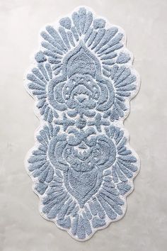 a blue rug with an intricate design on it