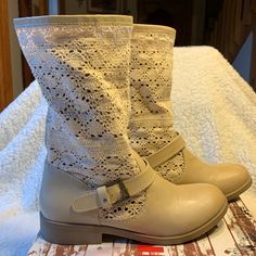 New Boots. No Scuffs, Rips Etc. Crochet Material Is Flawless. Rubber Soles & Heel For Comfort. Heel Is 1 Inch. Faux Leather Part Of Boot Is Bone Color & Crochet Part Is More Of A Cream Color. Adjustable Buckle. Ankle Boots, New Boots, Bone Color, Faux Leather Boots, Leather Boot, Cream Color, Bootie Boots, 1 Inch, Faux Leather