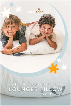 two children laying on a bed with the text safe & comfortable lounger pillow for kids