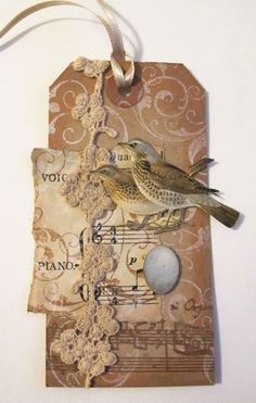 a bird sitting on top of a piece of paper with music notes attached to it