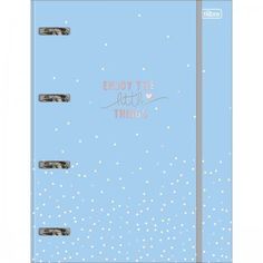 a blue notebook with the words enjoy the little things written on it and snow falling around