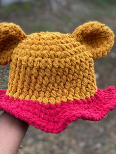 "Super cute Pooh inspired bucket hat! Perfect for your next trip to the parks! Fits 21\"-24\" circumference head. The yarn does stretch, so those with smaller heads will create a more oversized, loose look while those with bigger heads will find the hat snugger.  Also feel free to leave a note at checkout with measurements so I can adjust the size for an accurate fit!" One Size Fits Most Yarn Sun Cap, Crochet Hats One Size For Outdoor, Yarn Bucket Hat One Size Fits Most, Cotton Yarn Cap Hat, Outdoor Crochet Hat One Size Fits Most, Outdoor Crochet Hats, Hand Knitted Crochet Bucket Hat, One Size Fits Most Bucket Crochet Hat, Playful One Size Crochet Hat